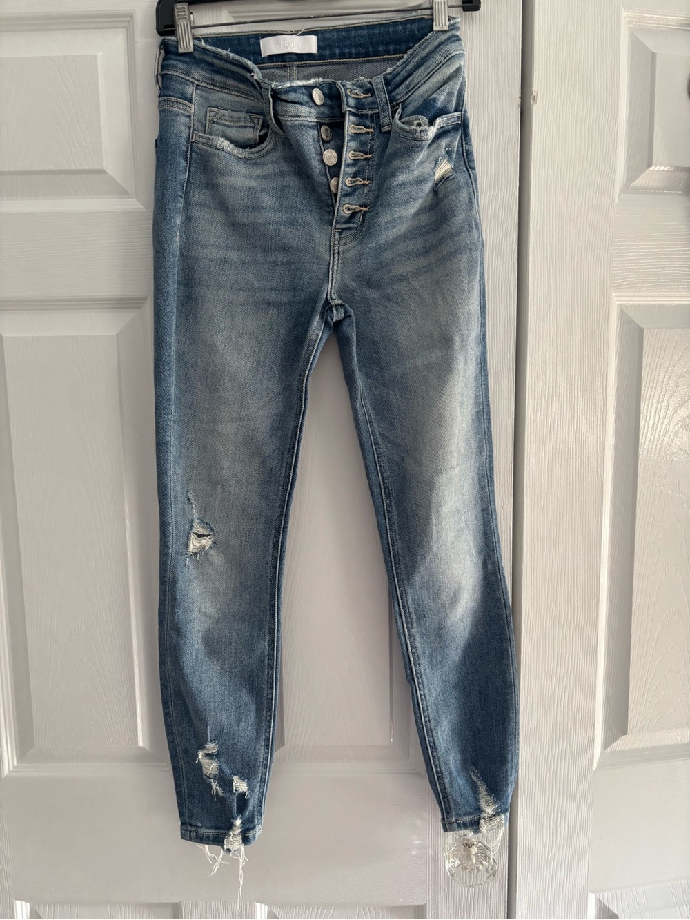 High-Rise Light Blue Skinny Jeans with Distressed Details